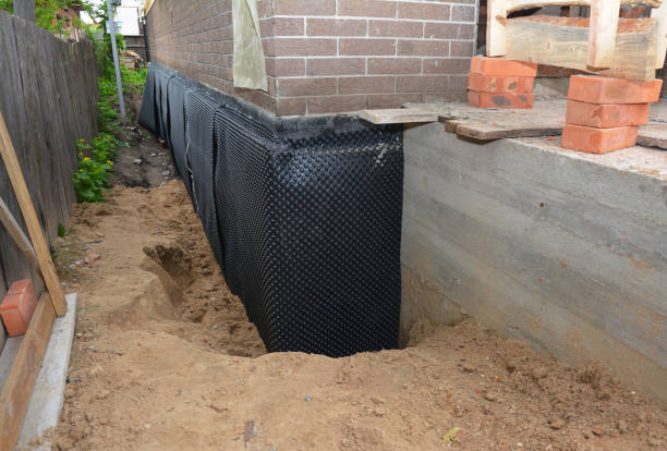 Happy homeowners after waterproofing job in Martinsville